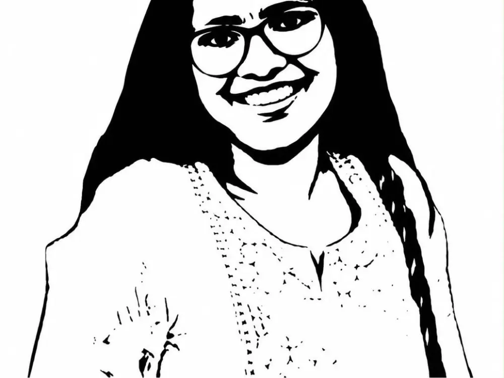 A black and white drawing of a woman with glasses above the text #FreeAkritiChaudhary