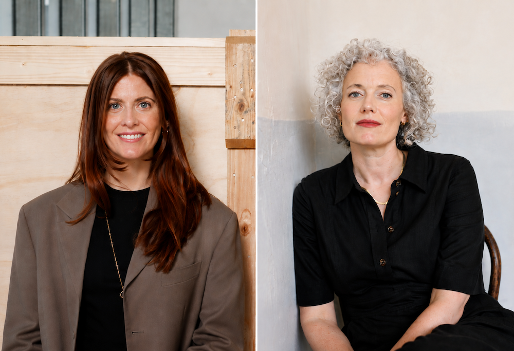 Dani Forest, left, smiles at the camera wearing a taupe blazer over a black top, standing against a pale wooden wall. Amelia Redgrift, right, sits against a light-colored wall wearing black, with short, tightly curled silver-gray hair.