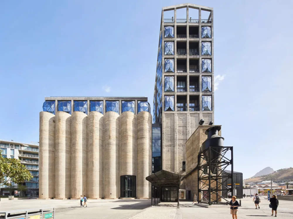 exterior of a concrete and glass museum against a blue sky