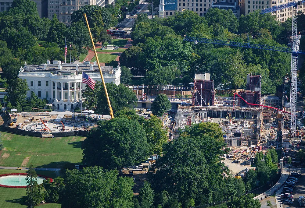 WASHINGTON, DC - JULY 30: Construction continues on a new helipad on the South Lawn of the White House and the East Wing ballroom on July 30, 2026 in Washington, DC. (Photo by Kevin Carter/Getty Images)