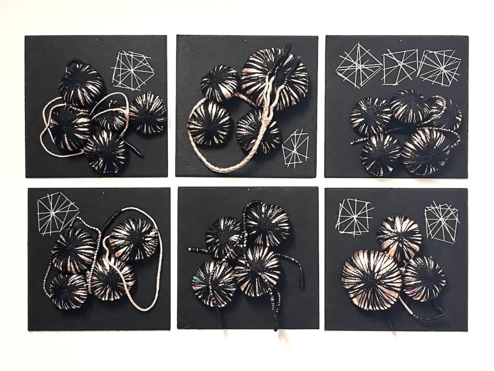 Six panels featuring drawings of orbs connected by string.