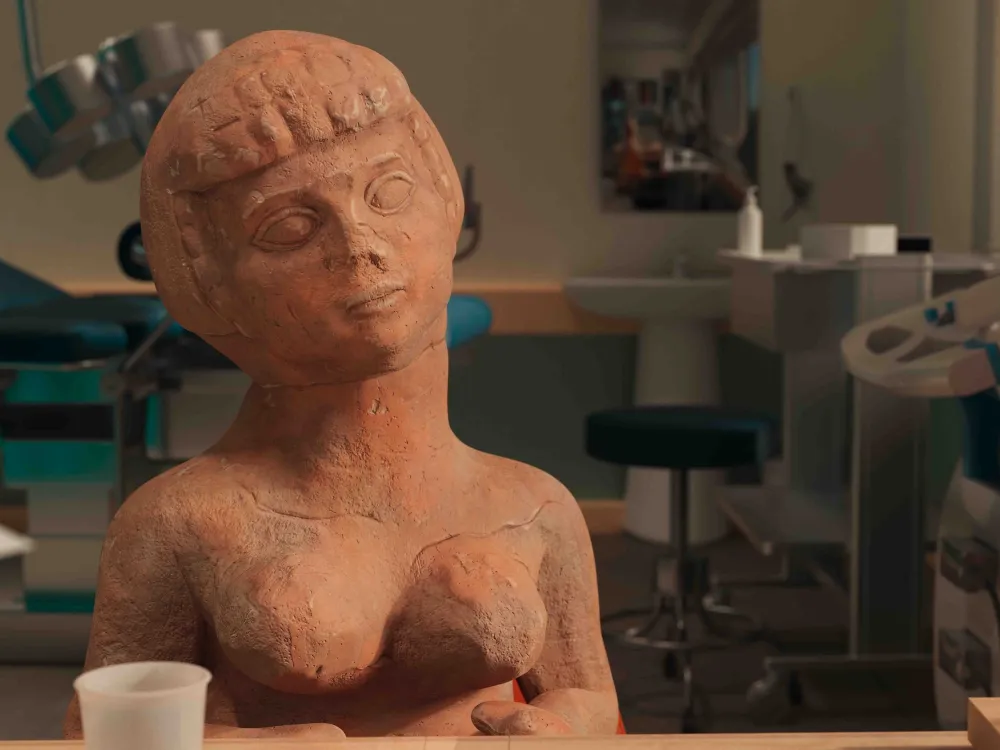 A clay sculpture of a woman in a doctor