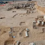 Aerial view of excavations at the Tell El-Deir archaeological site showing newly excavated funerary stelae