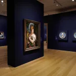 An art gallery displays paintings and sculptures.
