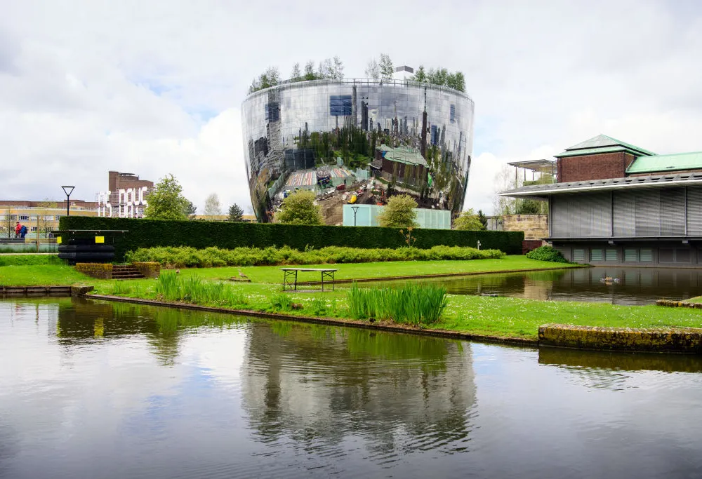 17 May 2021, Netherlands, Rotterdam: The depot of the Museum Boijmans Van Beuningen, which is currently under construction. The building, which is about 60 meters high, was designed by the architectural firm MVRDV, has a diameter of about 40 meters, and its shape is reminiscent of a mirrored soup or salad bowl. Art is to be arranged on five floors in the depot, with levels for temporary exhibitions in between. The opening is planned for autumn 2021. Photo: Soeren Stache/dpa-Zentralbild/dpa (Photo by Soeren Stache/picture alliance via Getty Images)