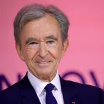 A smiling man in a suit.