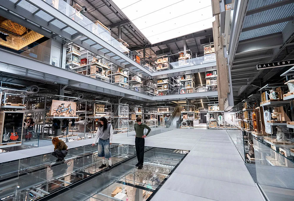 interior of a building with skylights and lots of objects on view