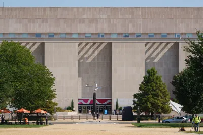 A photo shows the Smithsonian National Museum of American History, an imposing building with a landscaped plaza with sculptures in front
