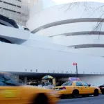 NEW YORK - JANUARY 21:  Traffic moves past the front of the Solomon R. Guggenheim Museum January 21, 2004 in New York City. Designed by architect Frank Lloyd Wright, the Guggenheim Museum was completed in 1959.  (Photo by Stephen Chernin/Getty Images)