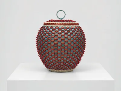 A vessel that has red elements atop the blue base with a circle atop.