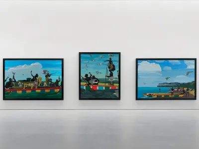Installation view of three paintings showing Black men in ships.