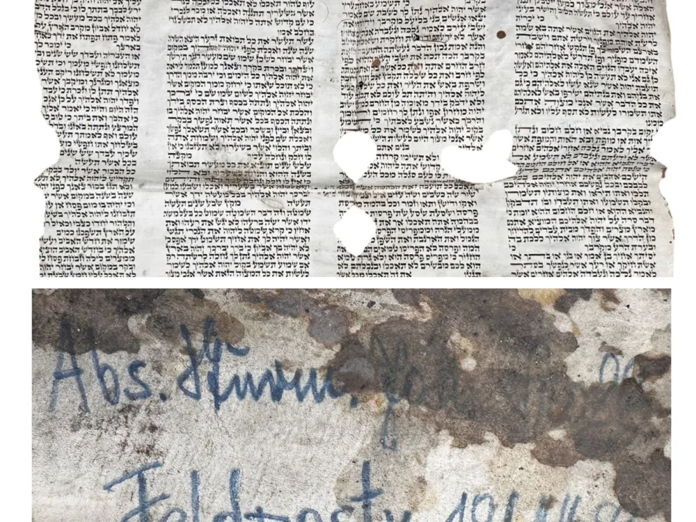 The front and back of a damaged Torah scroll fragment.